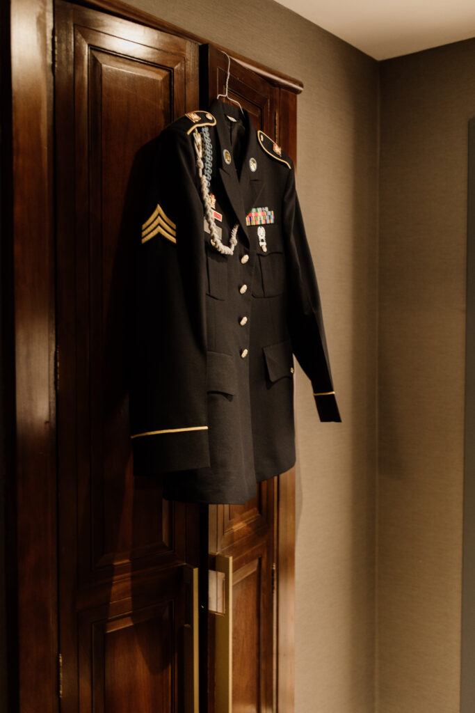 Army uniform hung on closet door for wedding day at The Goodwin Hotel Hartford CT 
